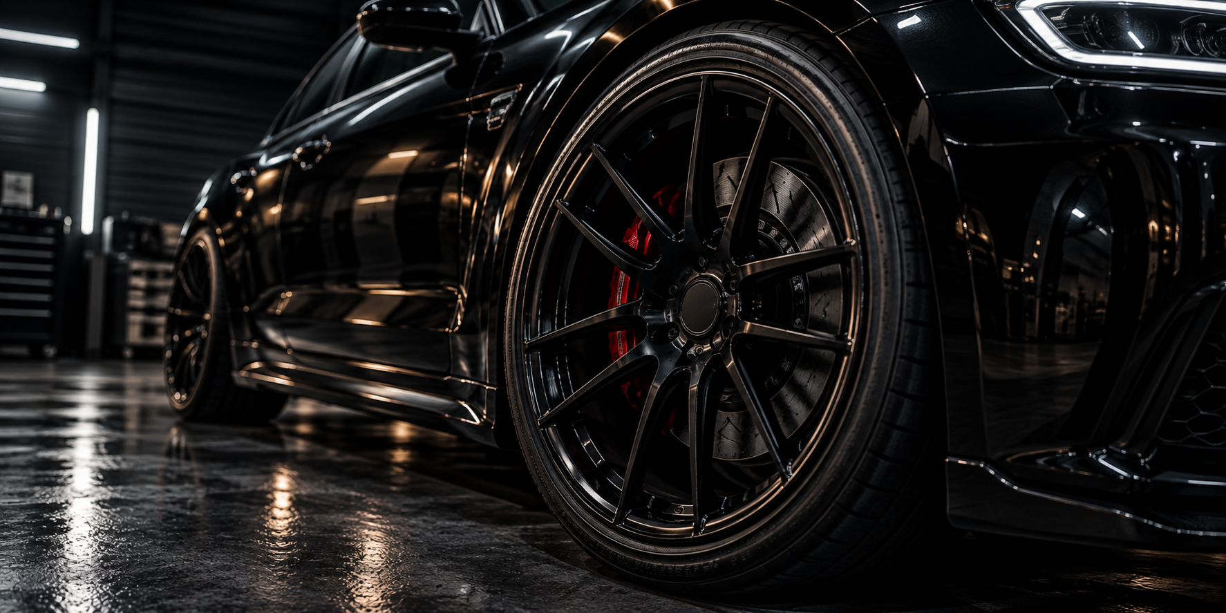 Close-up of aftermarket wheel, tire, and performance brake